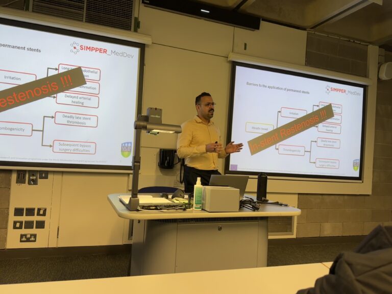 Masih presenting his research on 4th March 2024. He is standing in front of projected research slides